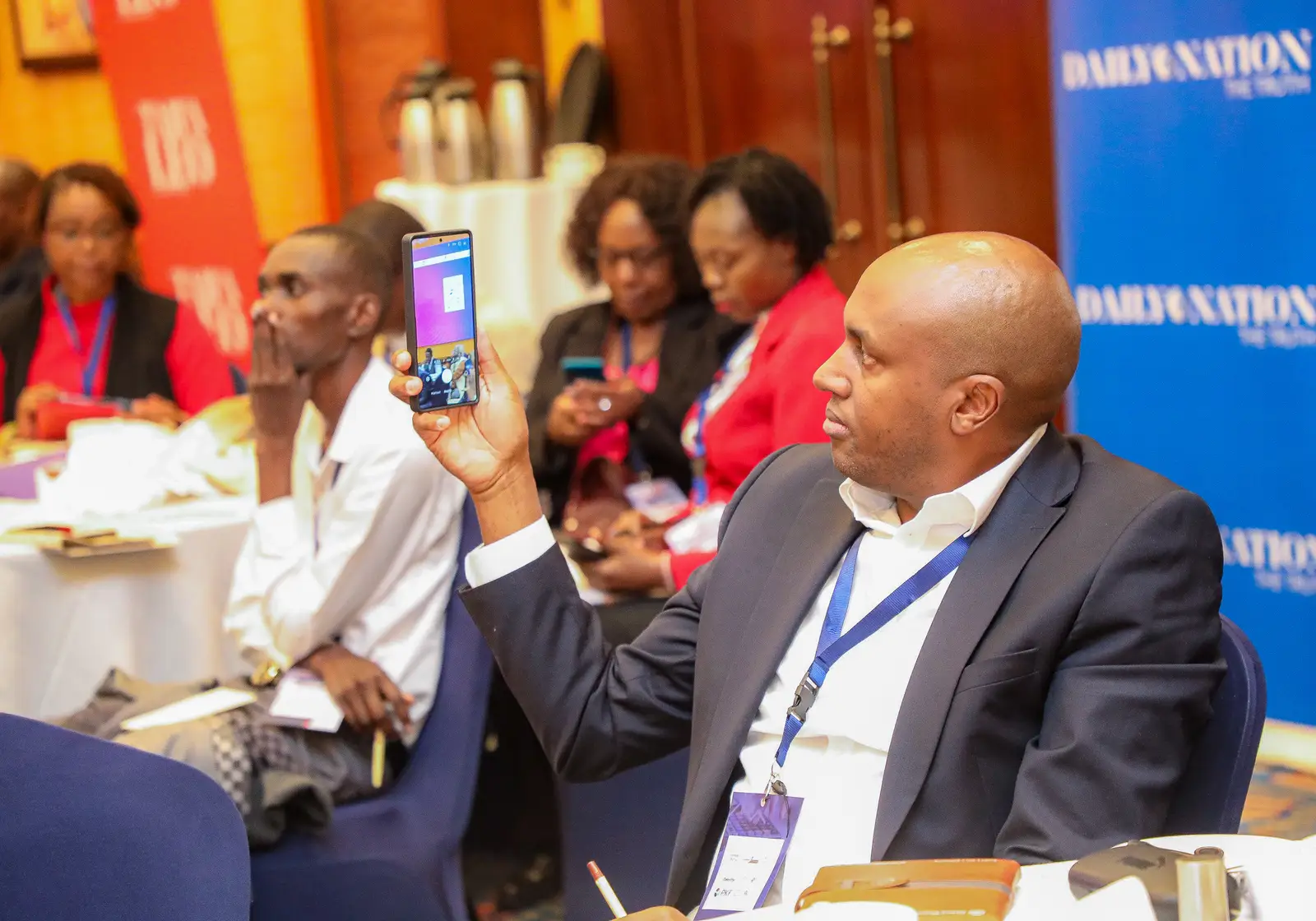 Delegate following proceedings at the Inaugural Tax Symposium, Nairobi